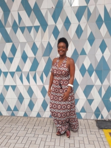 Marcia Cirino in front of a geometric patterned wall