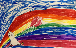 Kids drawing of a unicorn holding a balloon in front of a rainbow